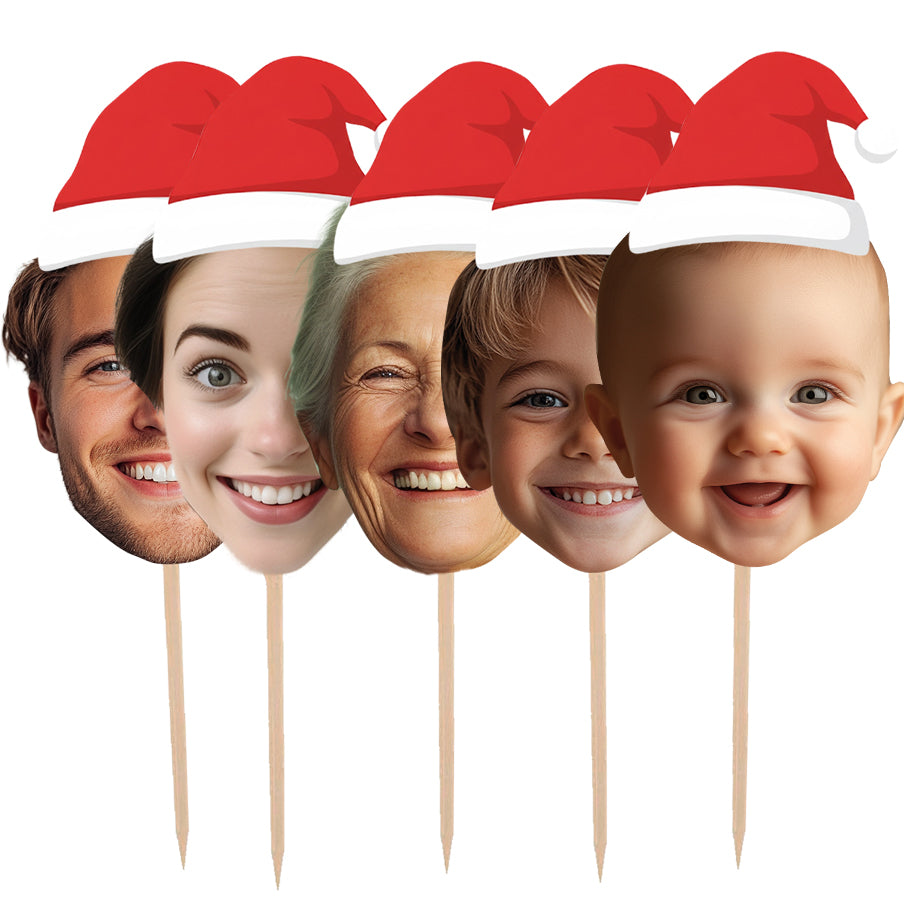 Five cake toppers with Santa hats on wooden sticks against a white background personalised christmas decorations