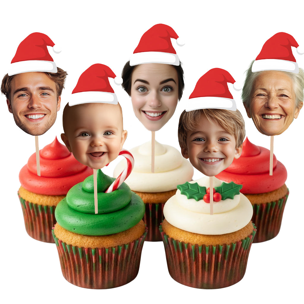 Cupcakes with Christmas-themed decorations and faces of people on top against a white background